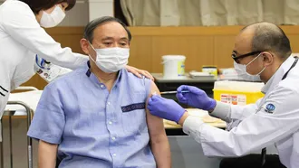 Japan’s PM receives first dose of Pfizer vaccine