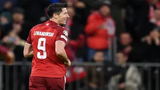 Lewandowski’s hat-trick steers Bayern into knockout stage