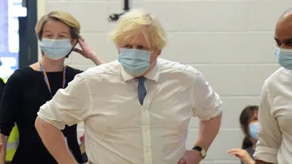 Britain reports first death with Omicron coronavirus variant