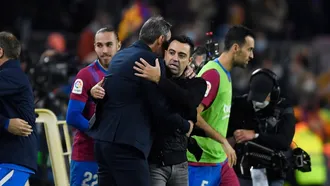 Barca edge past Espanyol to give Xavi debut victory as coach