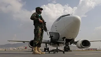Afghan police return to work alongside Taliban at airport